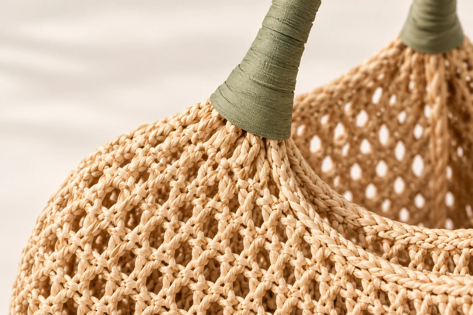 AI concept close-up of an open woven bag and sage fabric-wrapped handle connection